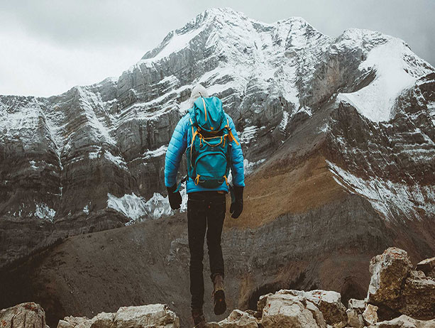Man hiking in the snowy mountains